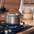 Stainless steel pot cooking on a gas stove.