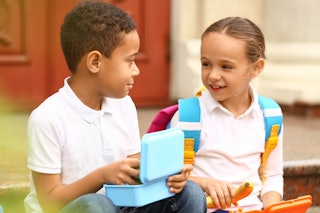 Two kids eating out of lunch boxes. A mom posted on Reddit, asking if she was in the wrong after his...