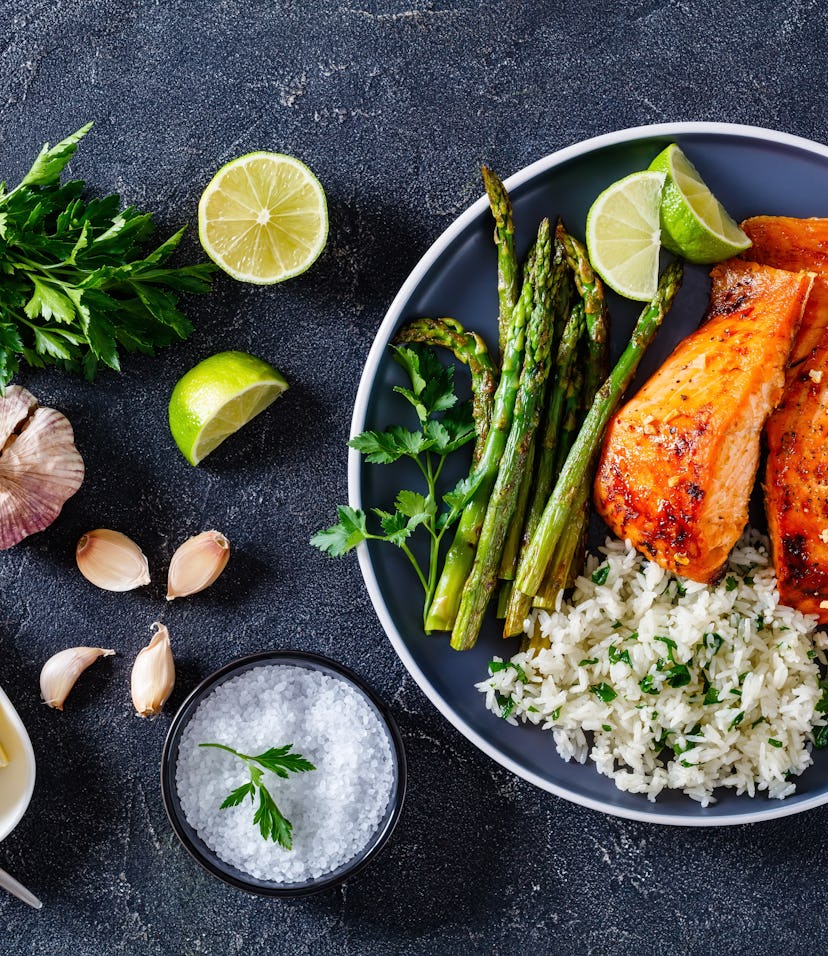 spring equinox recipe to celebrate the season: fried salmon fish fillets with asparagus, jasmine ric...