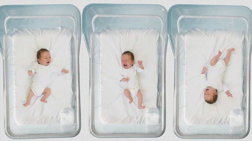 Three babies in hospital incubators.