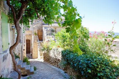Old street of Gordes, a small typical town in Provence, France. 