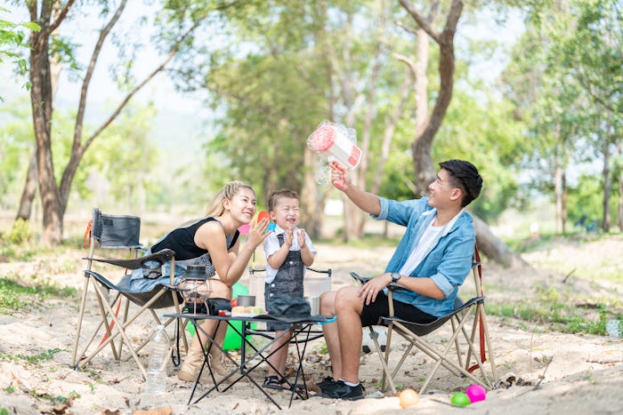 Family enjoying a camping holiday in the countryside ,Camping, travel, tourism, hiking and people. C...