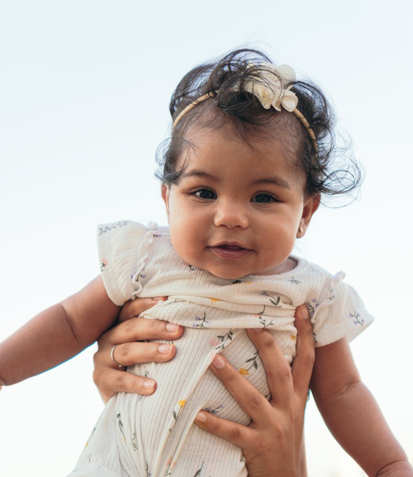 Portrait of a smiling baby outdoors at the park