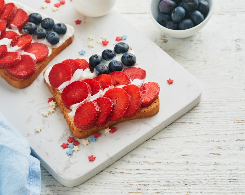4th of July American Independence Day food. American flag sandwich with strawberries, blueberries, w...