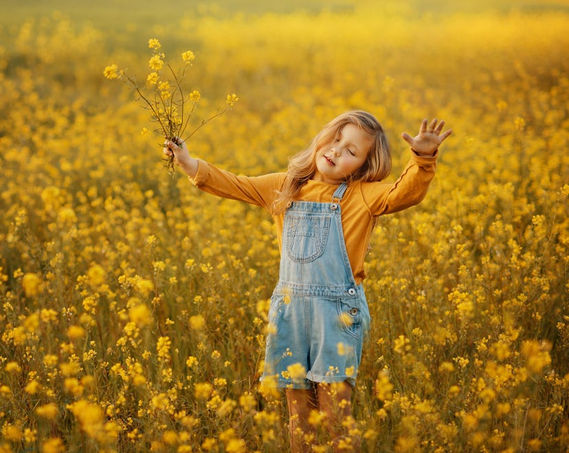 the girl is surrounded by nature and flowers