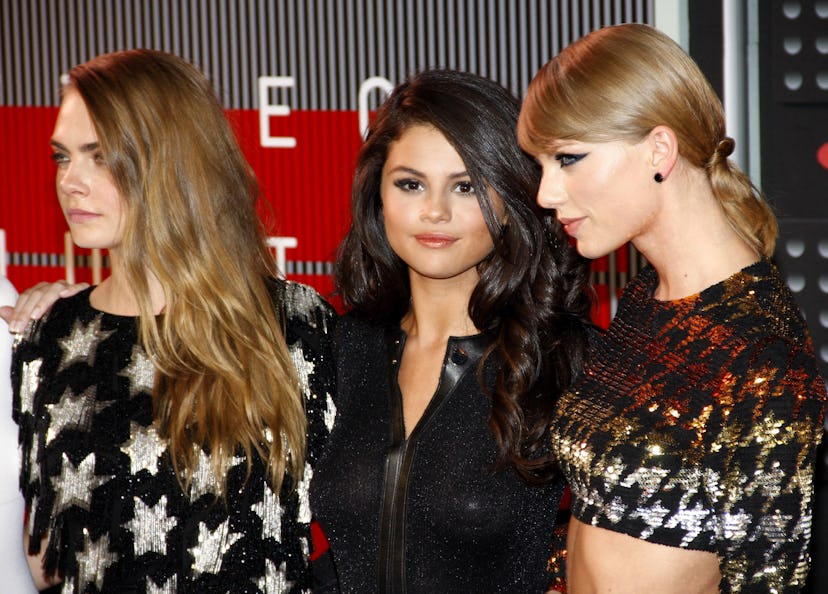 Cara Delevingne talked about living with longtime friend Taylor Swift.