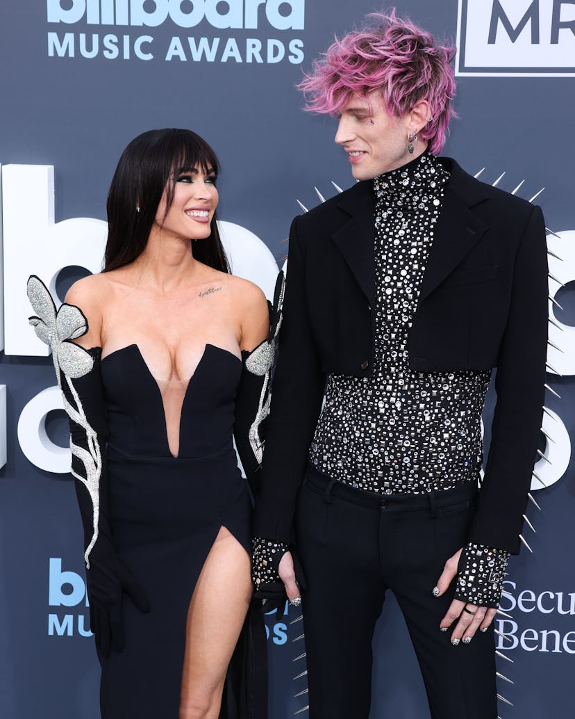 American actress Megan Fox and boyfriend/American rapper Machine Gun Kelly (Colson Baker) arrive at …