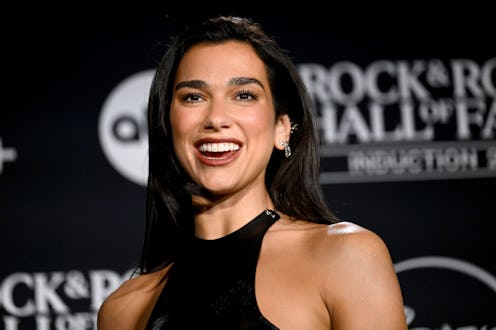 Dua Lipa's saucy Santa 'fit included a plunging neckline and fuzzy hot pants.
