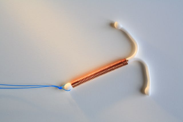 Contraceptive coin (intrauterine device IUD)