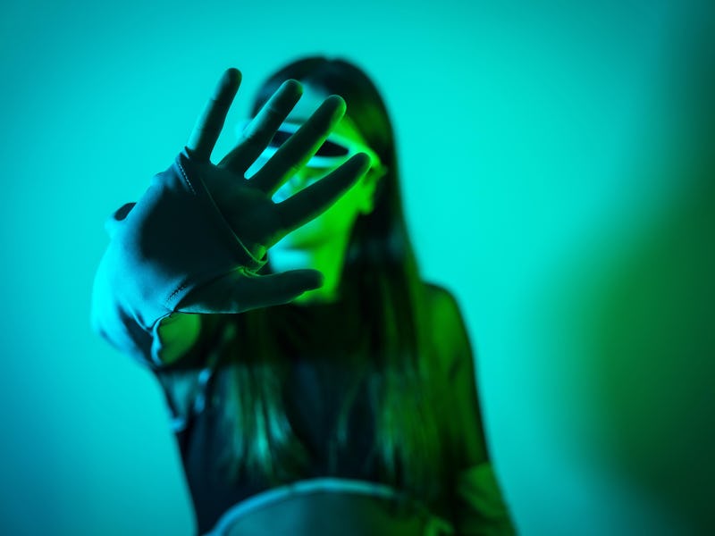 Model Released - Futuristic studio portrait with neon lights of a transgender man experimenting whil...