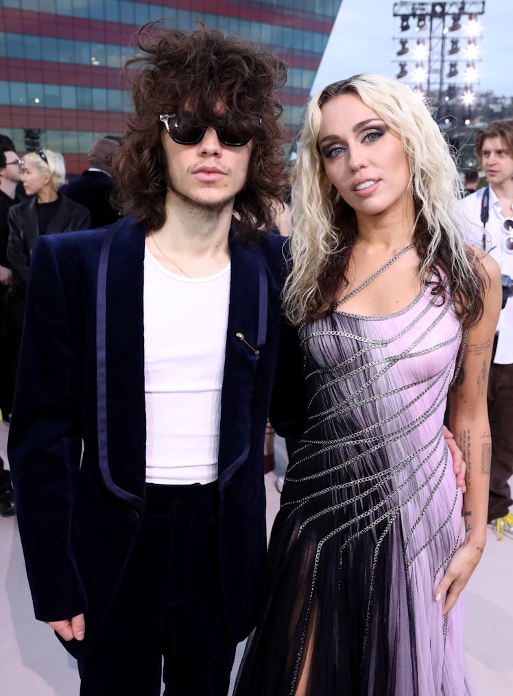 Maxx Morando and Miley Cyrus appeared at Versace’s FW23 Show in March 2023.