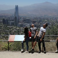 People watch a solar eclipse, in Santiago de Chile, Chile, 14 December 2020. A solar eclipse, partia...