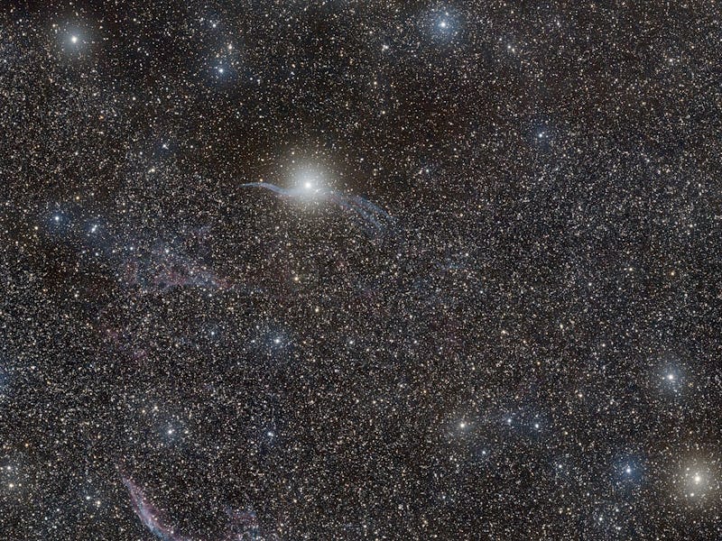 A stunning image of a star-filled night sky with the Veil Nebula NGC6960 in the Cygnus constellation
