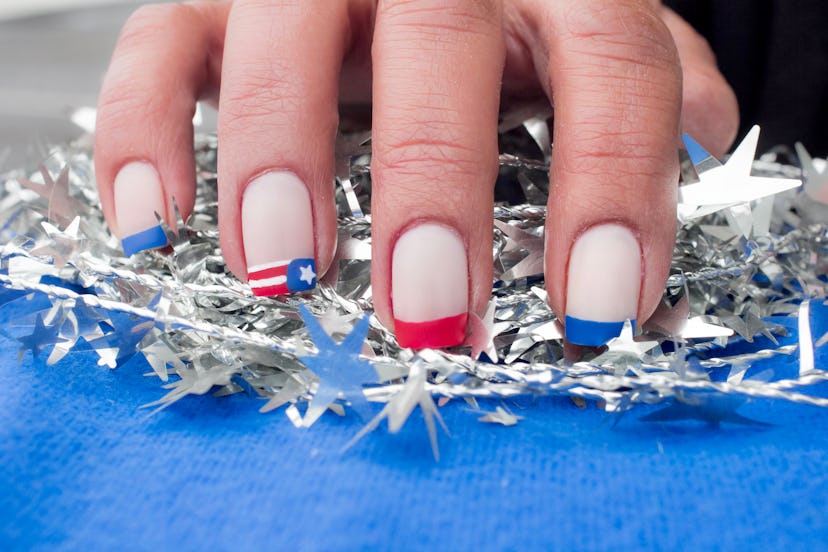 Fourth of July nails with colorful French tips in red and blue.