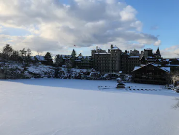 sunset view of famous hotel and wooden gazebo along hiking trail in upstate new york near new paltz ...