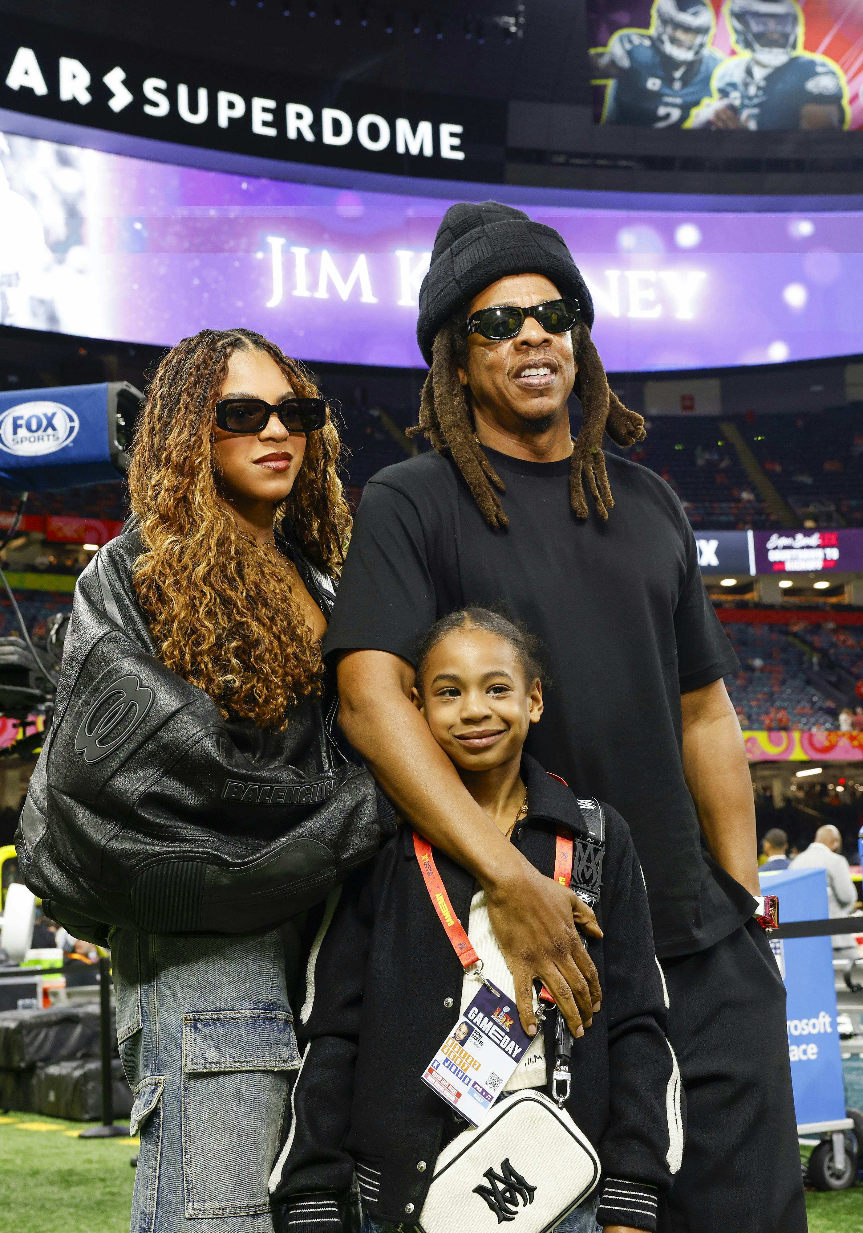 Entertainer Jay-Z is seen on the sideline with daughters Blue Ivy (L) and Rumi (C) before Super Bowl&hellip;