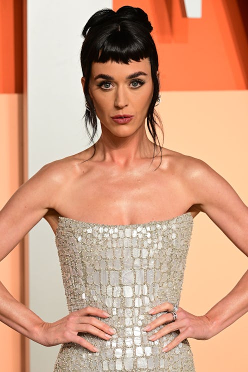 Katy Perry at the Vanity Fair Oscar Party before covering 'ELLE' magazine in a plunging black outfit...