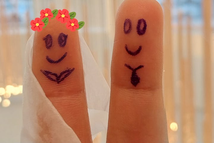creativity that produces cute art on the fingers, drawing a woman and a man getting married in a sim...
