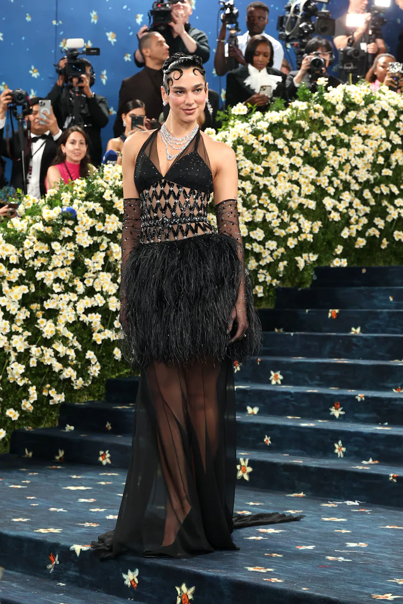 dua lipa new year dress Dua Lipa looks sensational as she steps out in stunning black gown to party with stars in New York