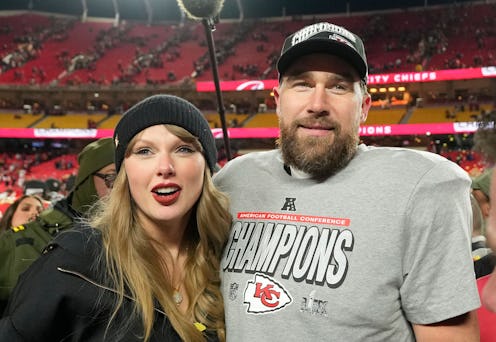 Kansas City Chiefs tight end Travis Kelce and his girlfriend entertainer Taylor Swift stand on the f...