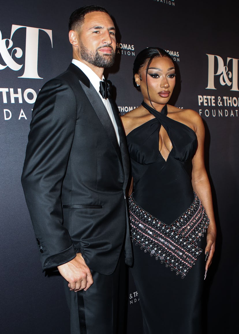 Klay Thompson and girlfriend Megan Thee Stallion (Megan Jovon Ruth Pete) wearing Off-White arrive at...