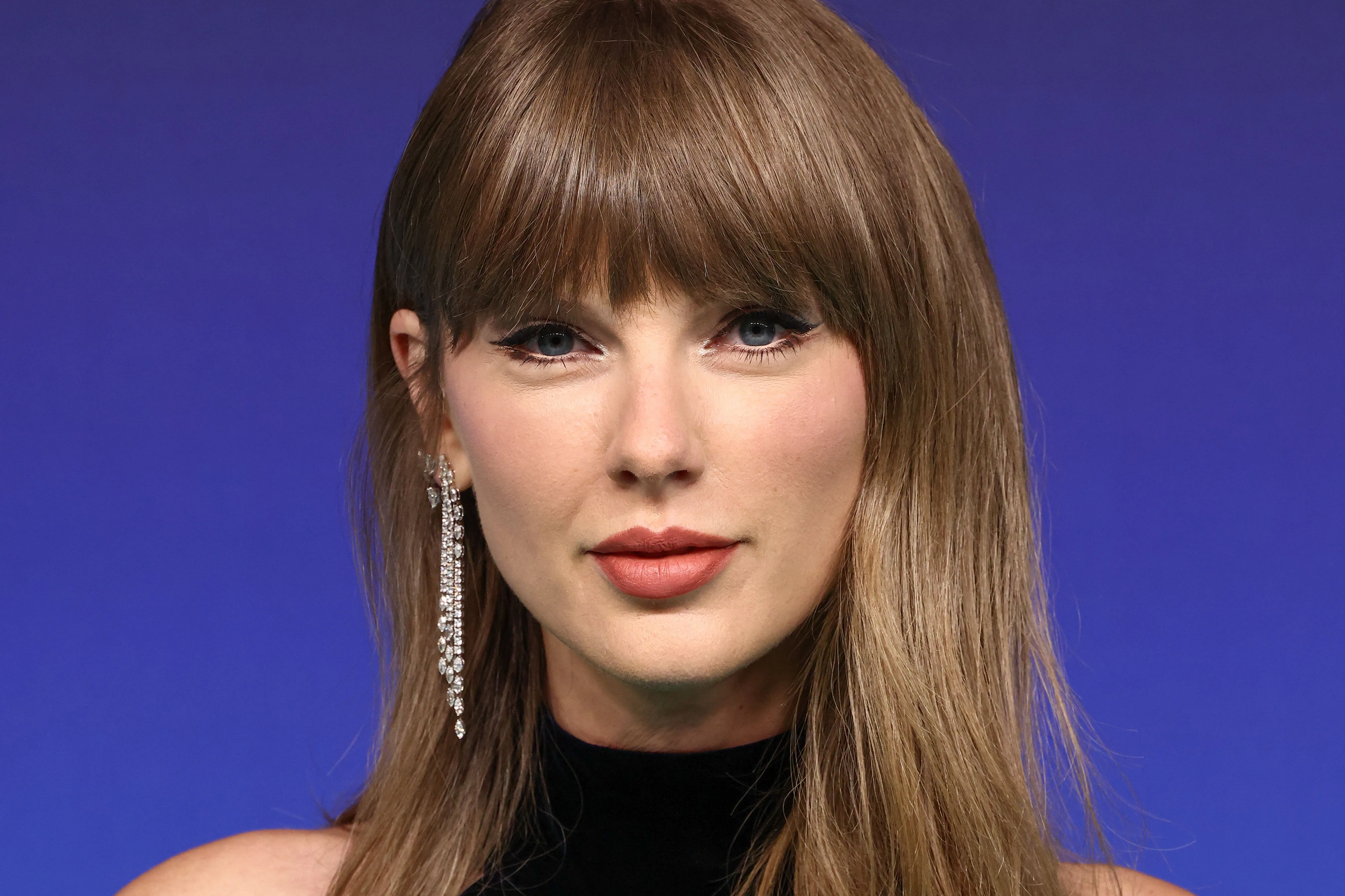 Taylor Swift wearing Tamara Ralph FW26 Couture, Leviev earrings, and Etho Maria and Forever Diamonds...