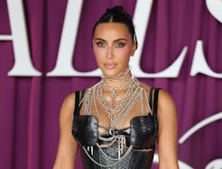 US reality TV personality and cast member Kim Kardashian poses on the carpet for the premiere of new...