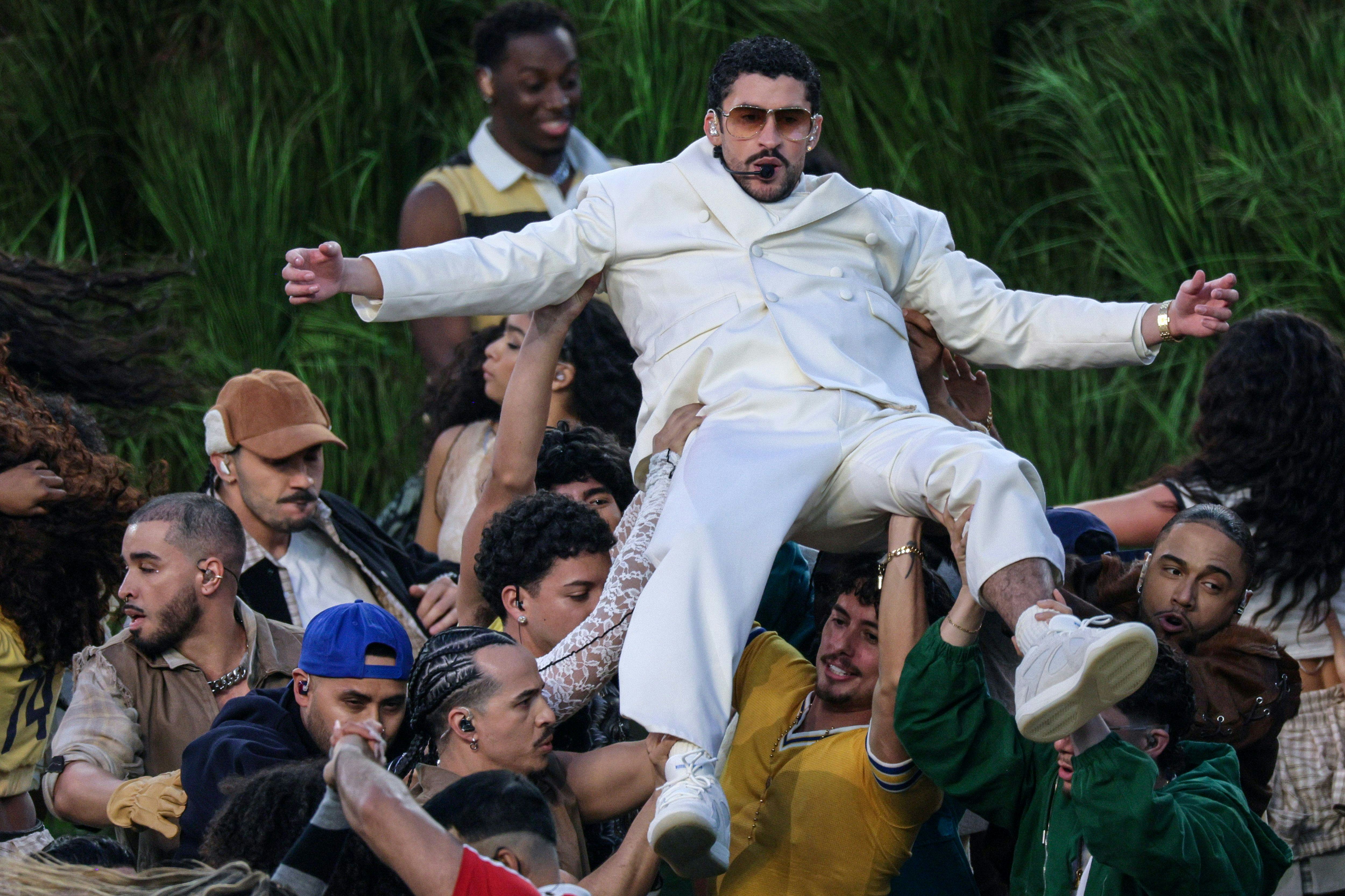 Bad Bunny performs in the Halftime Show of the Super Bowl LX between the New England Patriots and th...