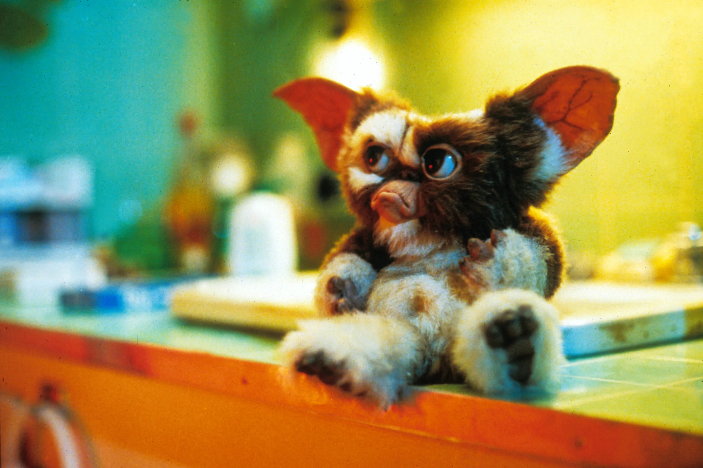 Gremlins 3 Release Date poster featuring the iconic Gizmo and a dark Halloween background