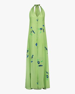 Mala Chetty's bright green button-front halter neck dress with floral designs. 