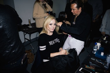 A hairdresser preparing Tiffany Trump's hairstyle for a fashion week event