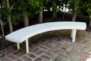 A white garden bench