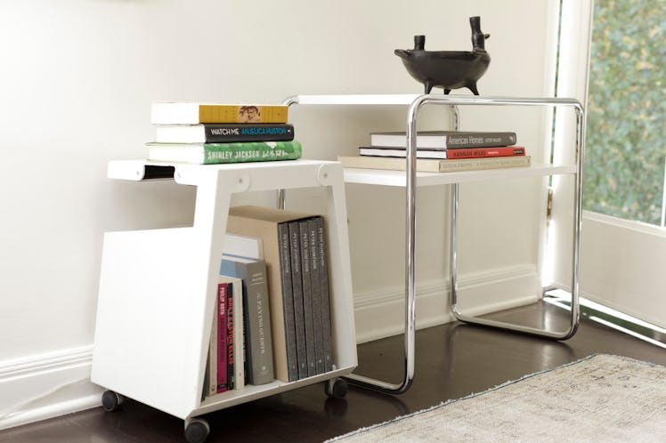 Olivares’s shelfs with books in a room corner