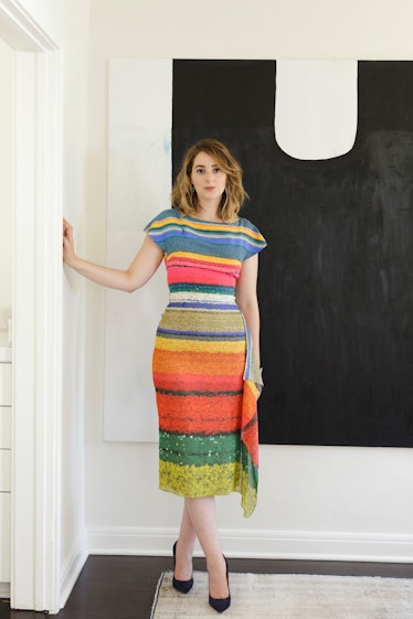 Hoffman posing in front of Raphaela Simon’s Umzug while wearing a colorful Akris dress