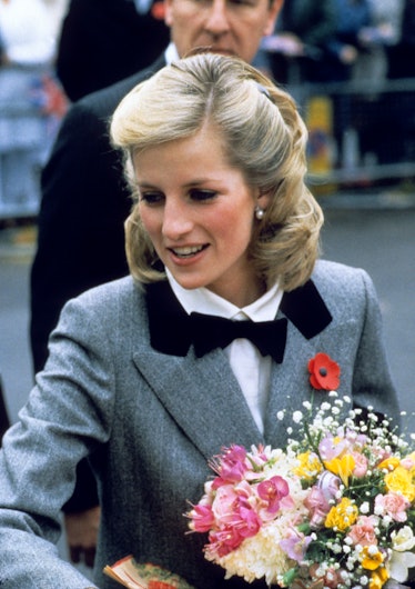 Princess Diana with long-ish, straight hair pulled back and a bowtie