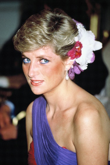 Princess Diana wearing blue eyeliner and a one-shoulder dress