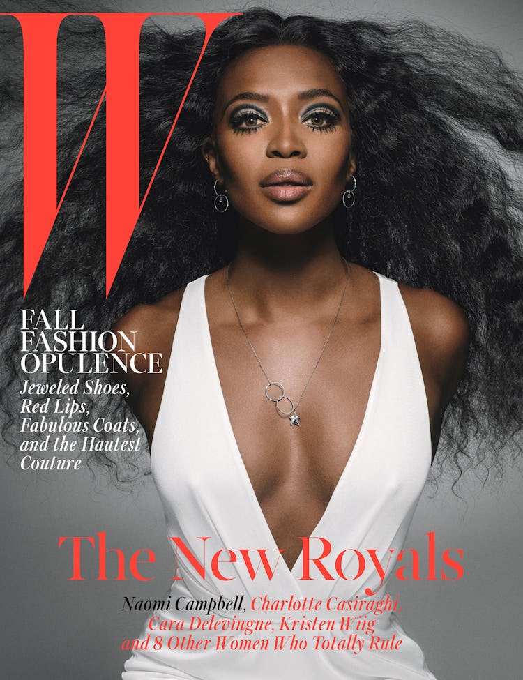 Naomi Campbell in a white V-neck dress on the cover of Q Magazine in 2014