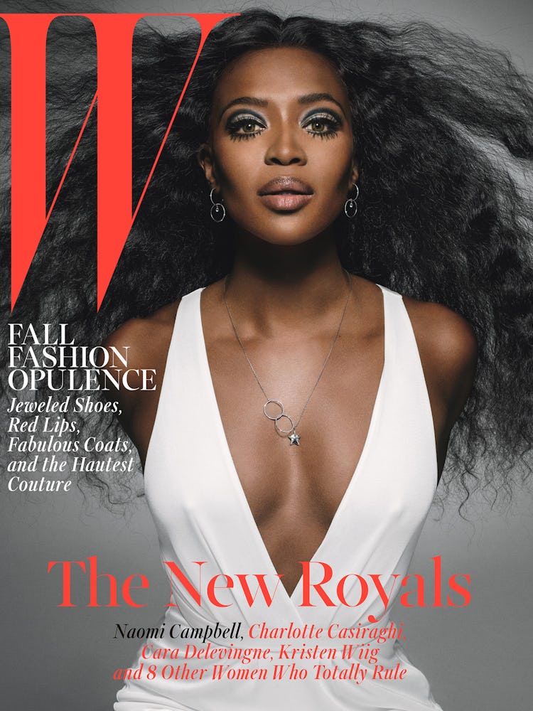 Naomi Campbell in a white V-neck dress on the cover of Q Magazine in 2014