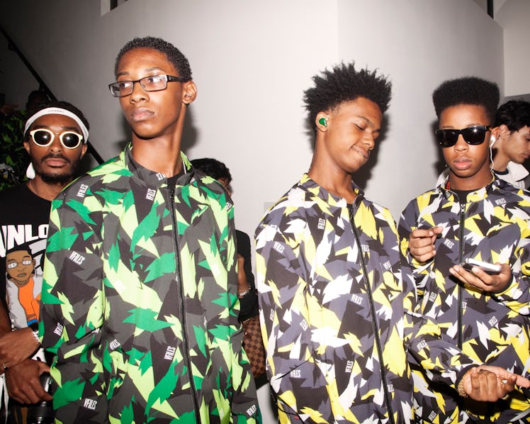 Models in green and yellow camo-looking jackets backstage at the VFiles Spring 2017 show 