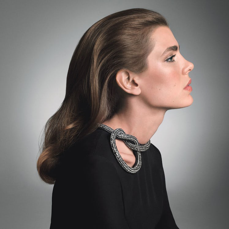 Charlotte Casiraghi posing for a photo in a black Gucci gown