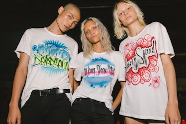 Models posing in Alexander Wang Spring 2017 t-shirts.