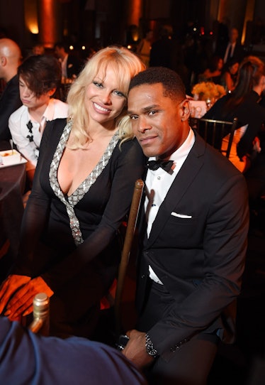 Pamela Anderson next to singer Maxwell at the UNITAS 2nd annual gala
