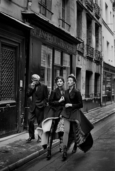 Lionel Vermeil, Helena Christensen, and Marie-Sophie Wilson walking down a Paris street