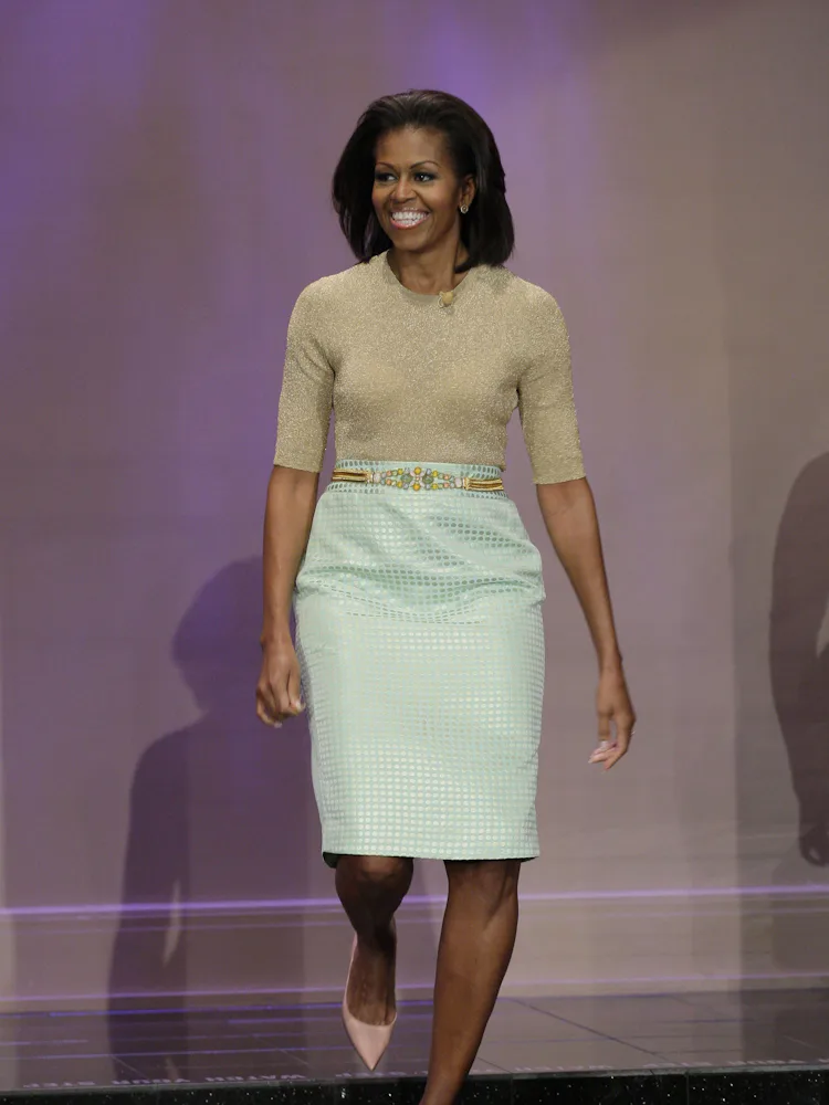 Melania Trump Wears Baby Blue Ralph Lauren, While Michelle Obama Opts for Red Melania Trump Wears Baby Blue Ralph Lauren, While Michelle Obama Opts for Red