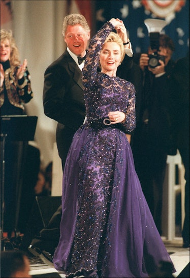 Hillary Clinton dancing in a navy lace dress with Bill Clinton in May 1995