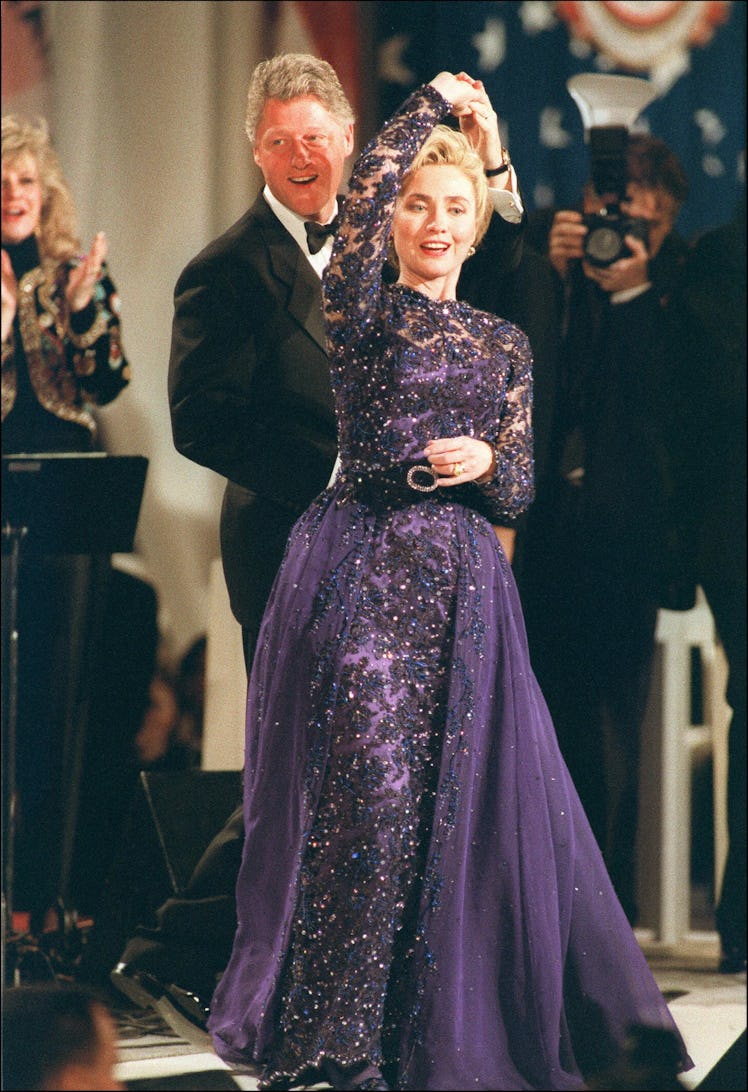 Hillary Clinton dancing in a navy lace dress with Bill Clinton in May 1995