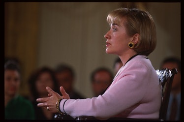 Hillary Clinton in a pink sweater wearing gold-black earrings in April 1994