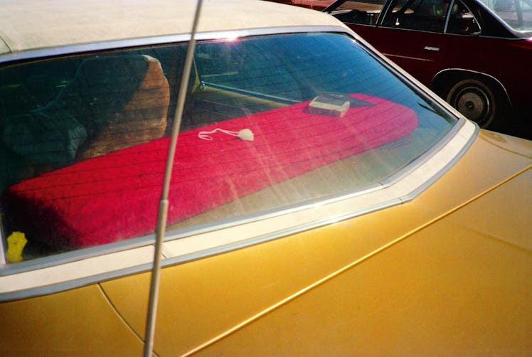 Trunk board of a yellow vintage car 