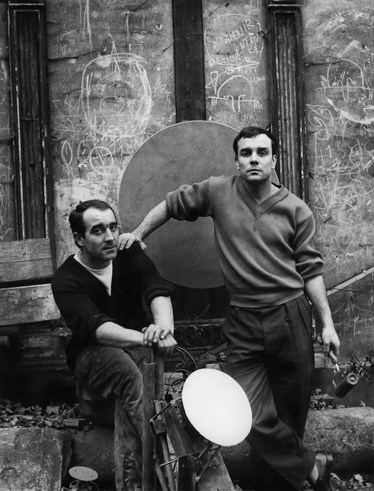 Jean Tinguely and Yves Klein posing together for a photo