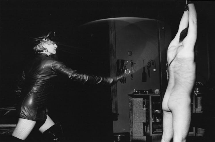 Doris Kloster, “Bullwhipping,” 1993. featuring a woman using a whip on a naked man